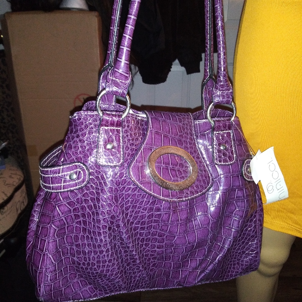 Purple embossed handbag
